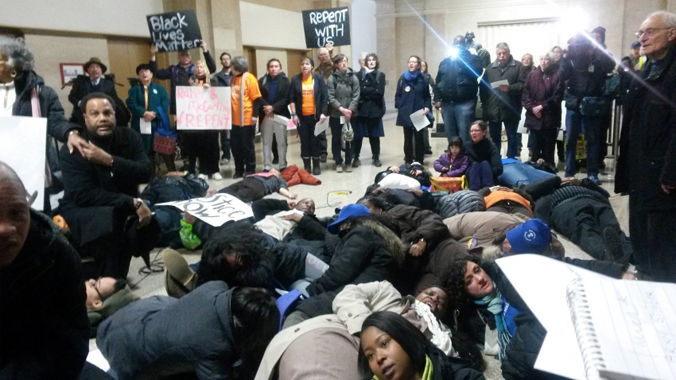 Chicago police grab a protester just outside Mayor Rahm Emanuel's office.